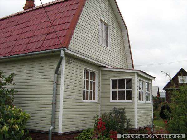 Обшивка фасада загородного дома сайдинг-панелями