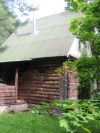 Дом баня с бассейном в окружении леса