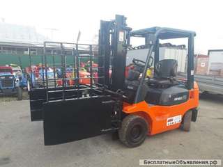 Вилочный погрузчик Toyota 7FD18 с киповым захватом