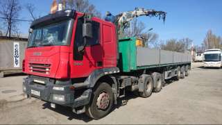 Сдам в аренду тягач Iveco Trakker с п/прицепом с КМУ (гр/п 20 т, стрела 4 т, вылет 8 м)