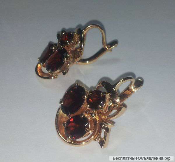 Роскошные золотые серьги с гранатами