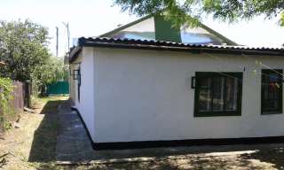 Дом с земельным участком общей площадью в 5,7