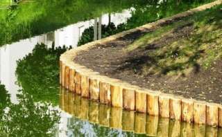 Берегоукрепление бревнами лиственницы и кедра