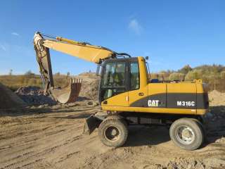 Колесный экскаватор CAT 316, линии, два ковша