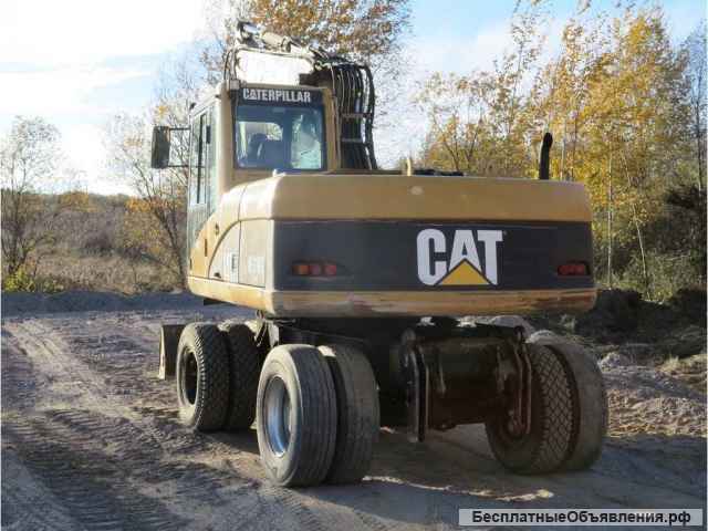 Колесный экскаватор CAT 316, линии, два ковша