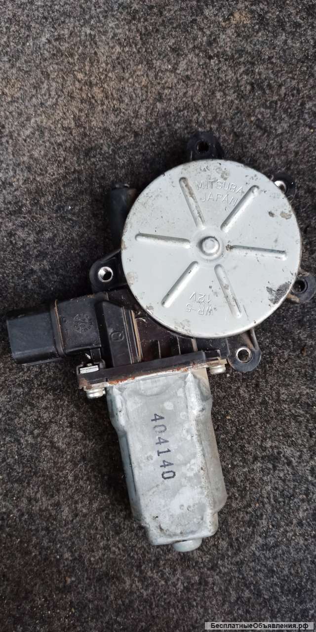 Моторчик стеклоподьемника передний левый лансер 9