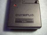 Зарядное устройство предназначен для фотоаппаратов OLYMPUS