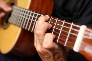 Быстрое обучение игре на гитаре