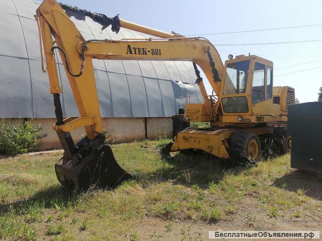Колесный экскаватор атек