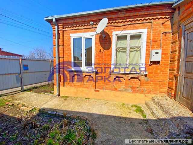 В центре города продается добротный кирпичный дом