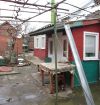 В Кропоткине по ул.Черноморской 1/2 часть дома (кирпичный) на земельном участке 2 сотки.