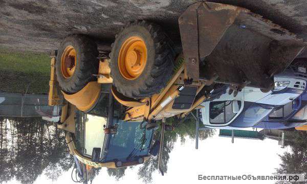 Экскаватор - погрузчик New Holland