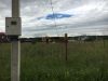 Участок в жилой деревне со светом, водой и домиком